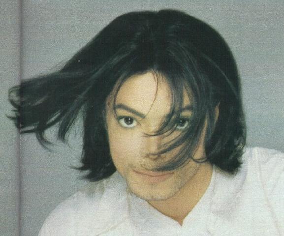 Michael Jackson with a litte beard - his hair is weaving in the wind